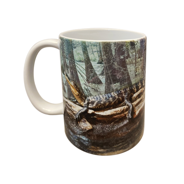Ceramic gator museum mug with baby gator and logo